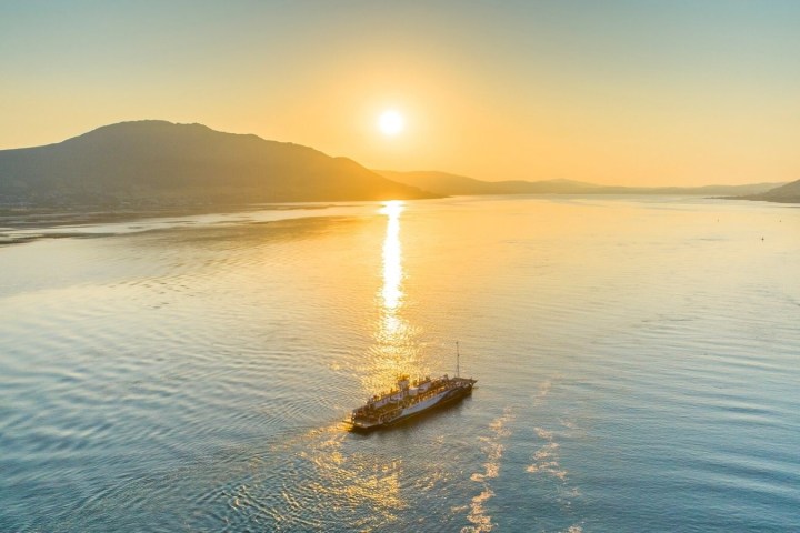 a small boat in a body of water